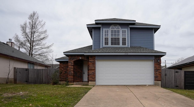 traditional-style house featuring fence, brick siding, a garage, a front yard, and driveway