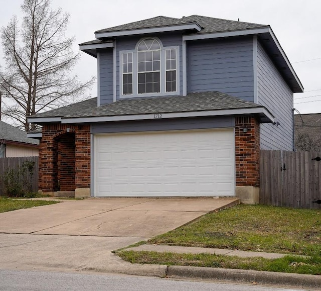 exterior space with a garage, fence, and brick siding