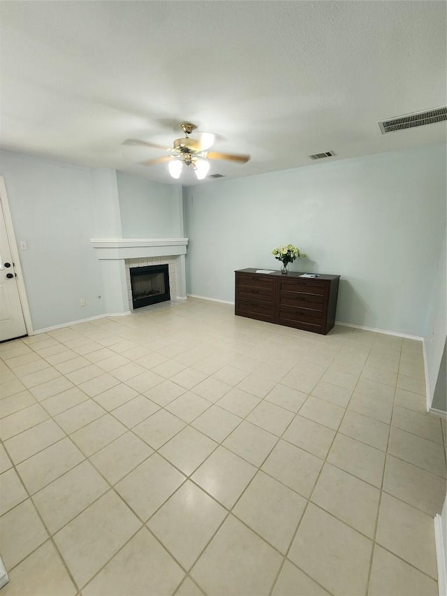 1712 Southwestern Dr, Round Rock, TX 78664 - living area featuring ceiling fan, a tile fireplace, and light tile patterned floors