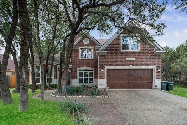 103 Sierra Ridge Dr, San Marcos, TX 78666 - view of front of house featuring concrete driveway, brick siding, a garage, a front yard, and stone siding