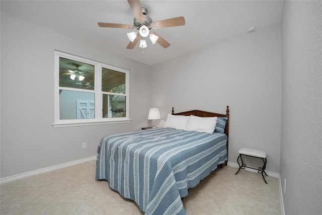 103 Sierra Ridge Dr, San Marcos, TX 78666 - bedroom featuring light tile patterned floors, baseboards, and ceiling fan