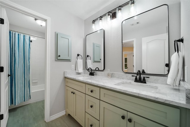 103 Sierra Ridge Dr, San Marcos, TX 78666 - bathroom featuring a sink, double vanity, shower / bathtub combination with curtain, and visible vents