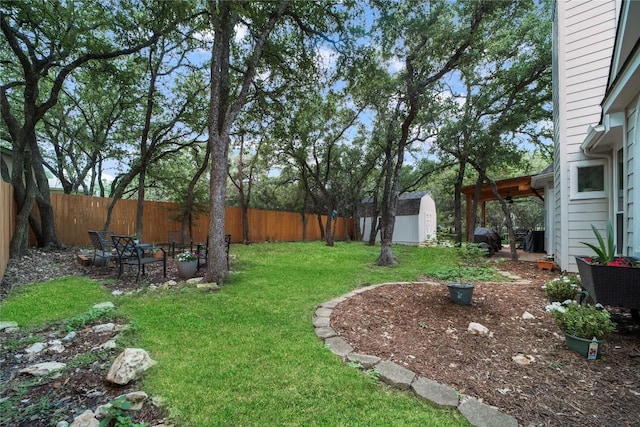 103 Sierra Ridge Dr, San Marcos, TX 78666 - view of yard with a fenced backyard, a shed, and an outbuilding