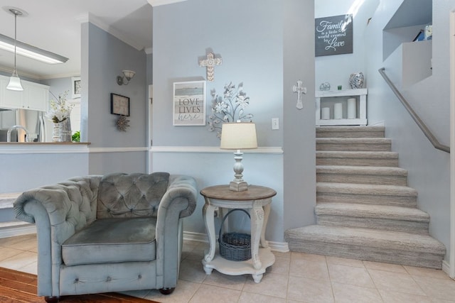 interior space with crown molding, baseboards, and tile patterned floors