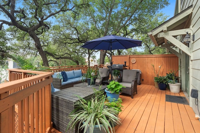 wooden deck featuring an outdoor hangout area