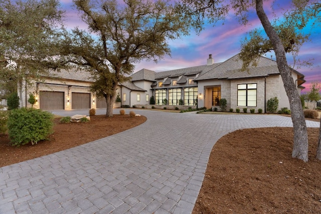 229 Tiffanie Way, Austin, TX 78737 - view of front of property with curved driveway, stucco siding, and a chimney