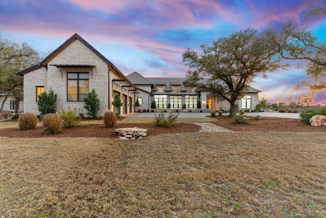 229 Tiffanie Way, Austin, TX 78737 - rear view of property featuring a lawn and stone siding
