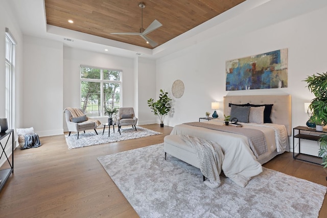 229 Tiffanie Way, Austin, TX 78737 - bedroom featuring recessed lighting, a tray ceiling, wood ceiling, and wood finished floors