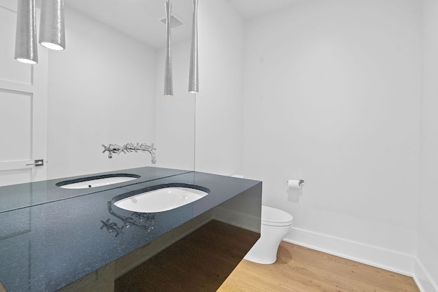 229 Tiffanie Way, Austin, TX 78737 - bathroom with vanity, visible vents, wood finished floors, toilet, and baseboards