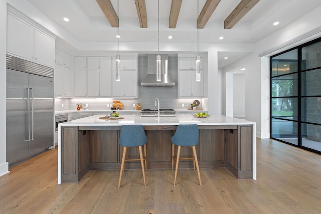 229 Tiffanie Way, Austin, TX 78737 - kitchen featuring wall chimney range hood, light wood-type flooring, backsplash, and stainless steel built in refrigerator