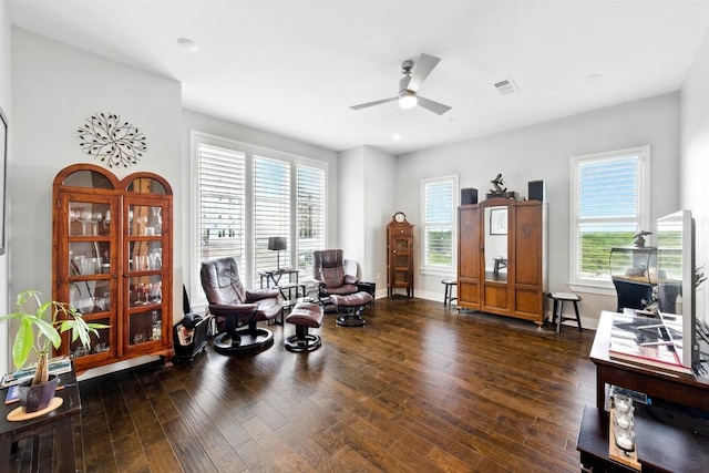 sitting room with a healthy amount of sunlight, recessed lighting, ceiling fan, and dark wood finished floors