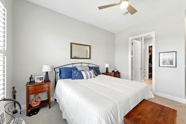 carpeted bedroom featuring baseboards, ceiling fan, and visible vents