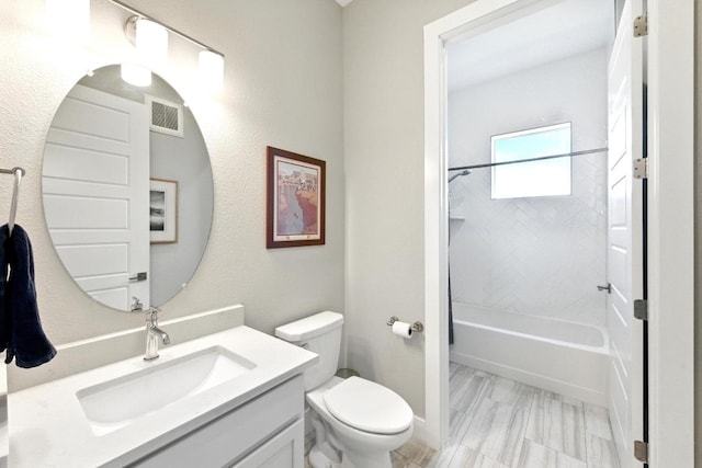 bathroom featuring shower / bathtub combination, toilet, visible vents, and vanity