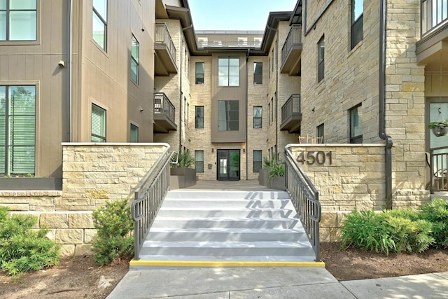 view of property featuring stairs
