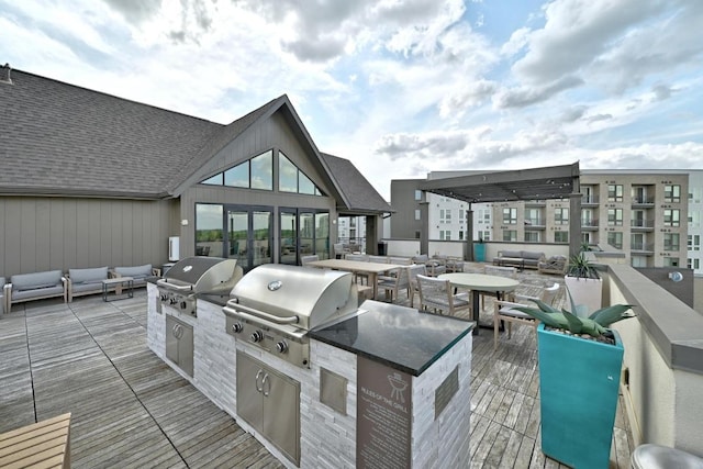 view of patio with grilling area, a deck, an outdoor hangout area, and area for grilling