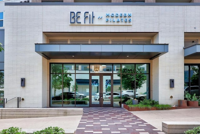 view of exterior entry featuring french doors