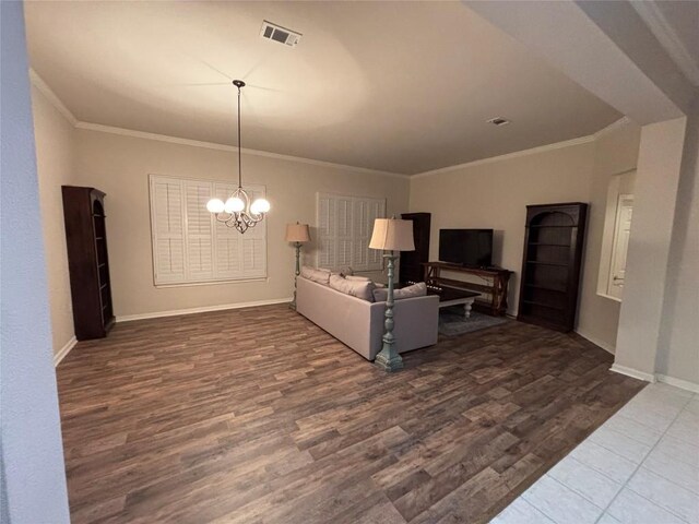196 Whispering Wind Dr, Georgetown, TX 78633 - living room featuring ornamental molding, a chandelier, wood finished floors, and baseboards