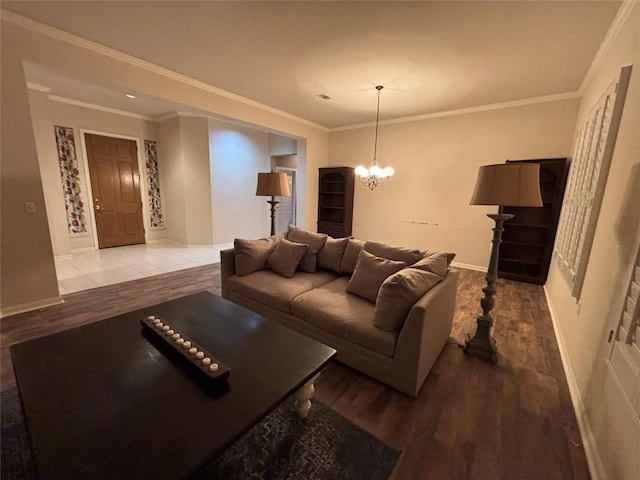 196 Whispering Wind Dr, Georgetown, TX 78633 - living area with wood finished floors, a chandelier, baseboards, and ornamental molding