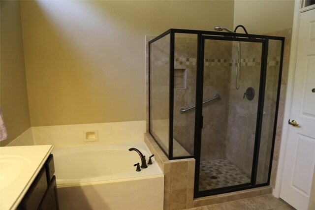 196 Whispering Wind Dr, Georgetown, TX 78633 - bathroom featuring a stall shower, a garden tub, and vanity