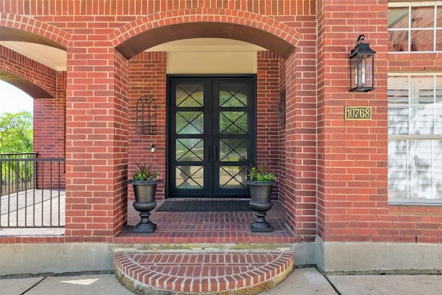 10768 Bramblecrest Dr, Austin, TX 78726 - view of exterior entry featuring french doors and brick siding