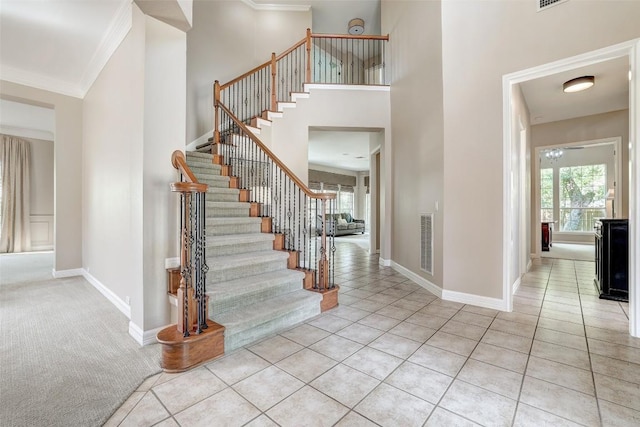 10768 Bramblecrest Dr, Austin, TX 78726 - tiled entrance foyer featuring ornamental molding, stairs, and a high ceiling