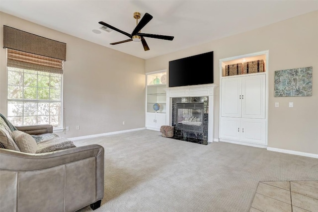 10768 Bramblecrest Dr, Austin, TX 78726 - living room with carpet, a ceiling fan, plenty of natural light, and a high end fireplace