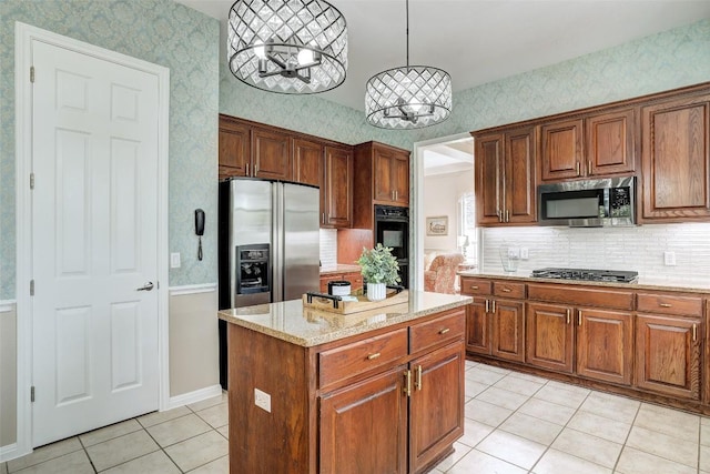 10768 Bramblecrest Dr, Austin, TX 78726 - kitchen with stainless steel appliances, a chandelier, light tile patterned floors, a center island, and wallpapered walls