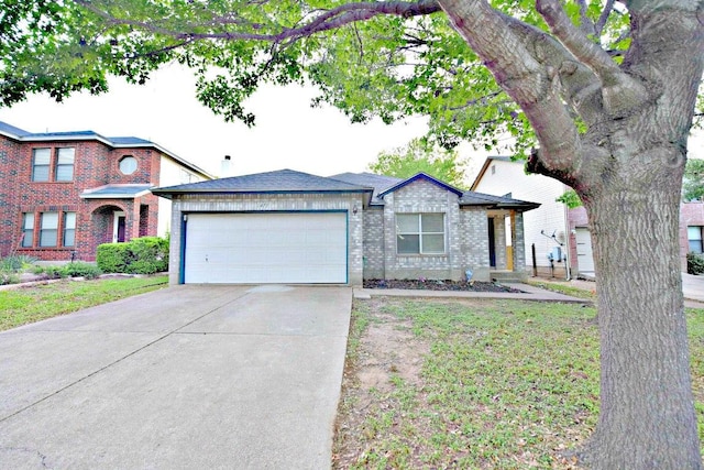 1411 Baffin Cv, Round Rock, TX 78664 - view of front facade with concrete driveway, brick siding, an attached garage, and a front yard
