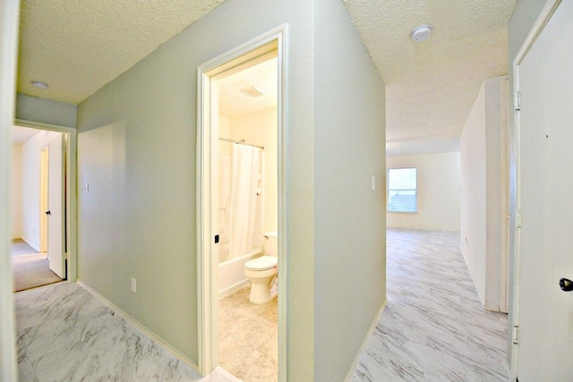 1411 Baffin Cv, Round Rock, TX 78664 - hallway with a textured ceiling