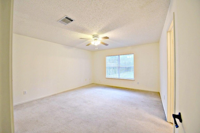 1411 Baffin Cv, Round Rock, TX 78664 - empty room with ceiling fan, a textured ceiling, visible vents, carpet floors, and baseboards