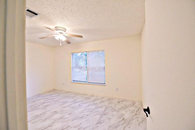 1411 Baffin Cv, Round Rock, TX 78664 - spare room featuring a ceiling fan, a textured ceiling, and visible vents