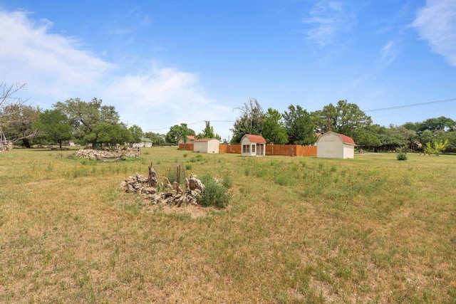 view of yard with a storage unit and an outbuilding