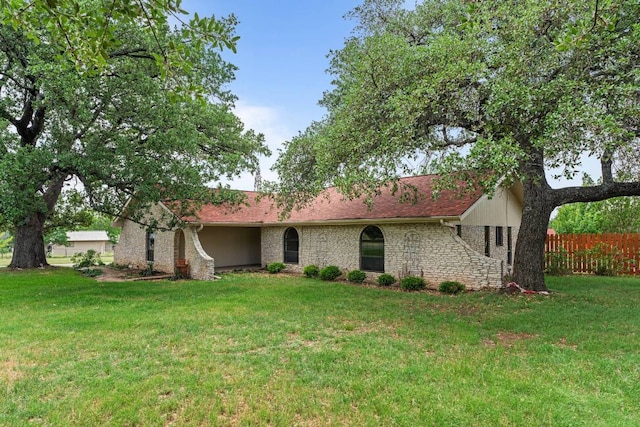 single story home featuring a front lawn and fence