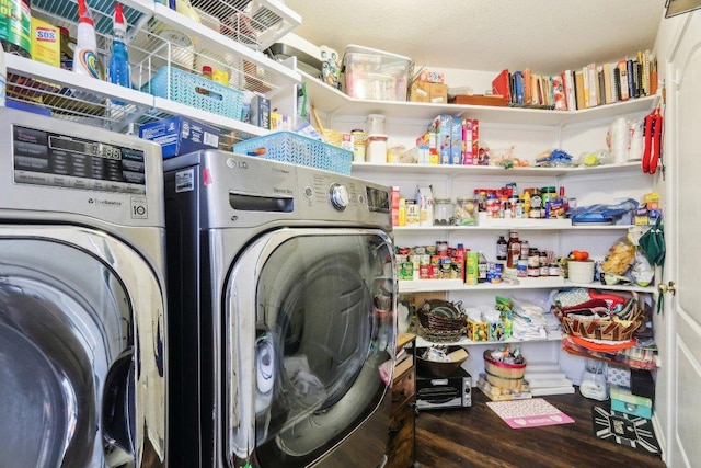 laundry room with separate washer and dryer, laundry area, and wood finished floors