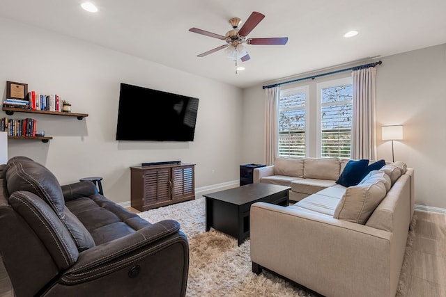 living area with a ceiling fan, baseboards, and recessed lighting