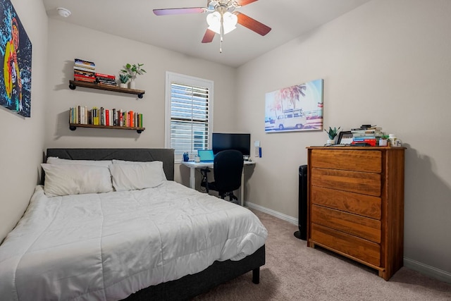 bedroom featuring a ceiling fan, baseboards, and light colored carpet
