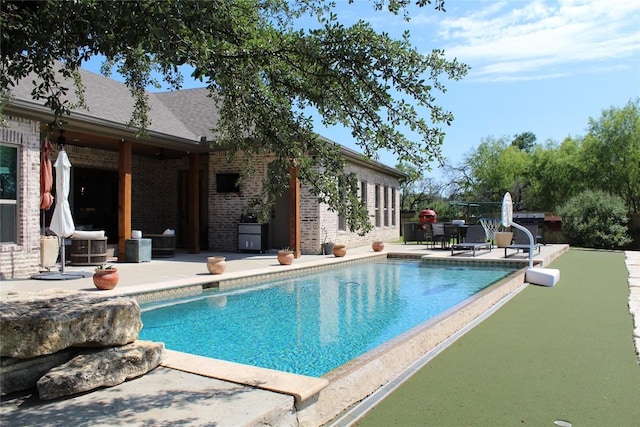 outdoor pool featuring a patio area