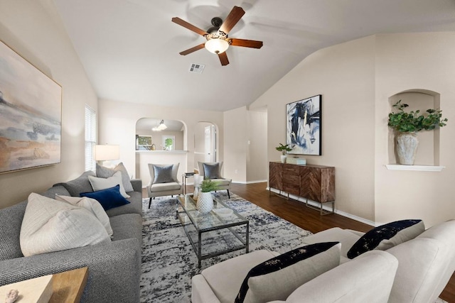 1777 Thompson Trl, Round Rock, TX 78664 - living area with a ceiling fan, visible vents, arched walkways, vaulted ceiling, and wood finished floors