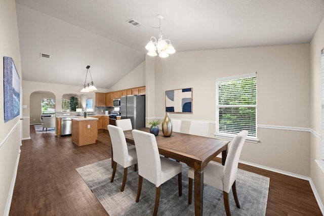 1777 Thompson Trl, Round Rock, TX 78664 - dining room featuring dark wood-type flooring, arched walkways, visible vents, and a wealth of natural light