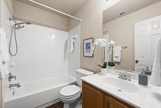 1777 Thompson Trl, Round Rock, TX 78664 - bathroom with a textured wall, vanity, toilet,  shower combination, and visible vents