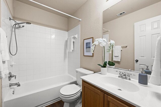 1777 Thompson Trl, Round Rock, TX 78664 - full bath featuring vanity, shower / bath combination, toilet, and a textured wall