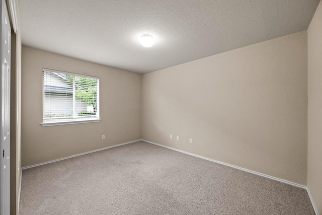 1777 Thompson Trl, Round Rock, TX 78664 - carpeted spare room featuring baseboards and a textured ceiling