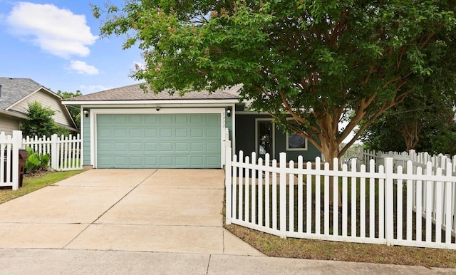 1777 Thompson Trl, Round Rock, TX 78664 - view of property hidden behind natural elements featuring an attached garage, driveway, and a shingled roof