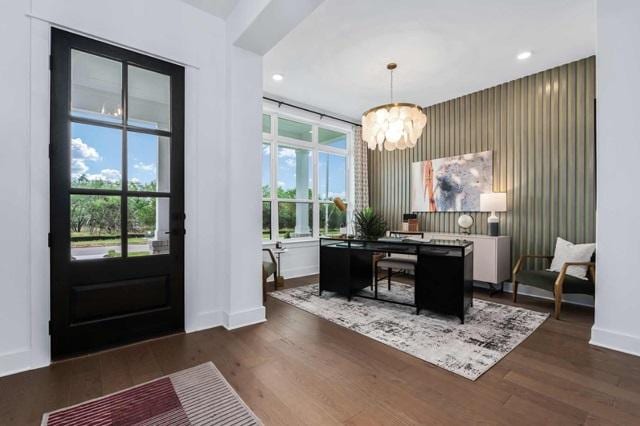 foyer entrance featuring recessed lighting, baseboards, a notable chandelier, and dark wood finished floors