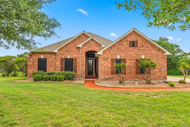462 Shelf Rock, Driftwood, TX 78619 - traditional-style home featuring a front yard and brick siding