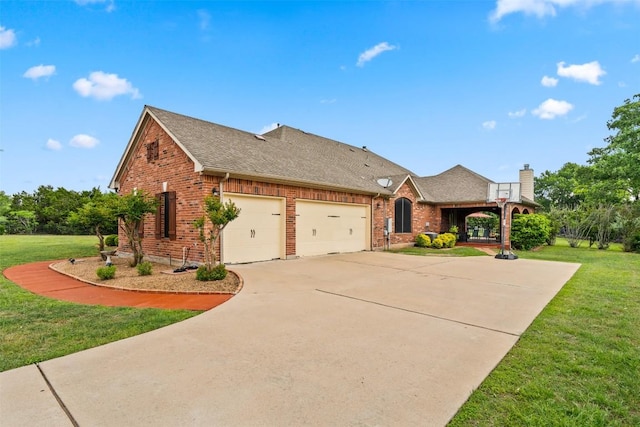 462 Shelf Rock, Driftwood, TX 78619 - view of front of property with brick siding, a front lawn, a garage, and driveway
