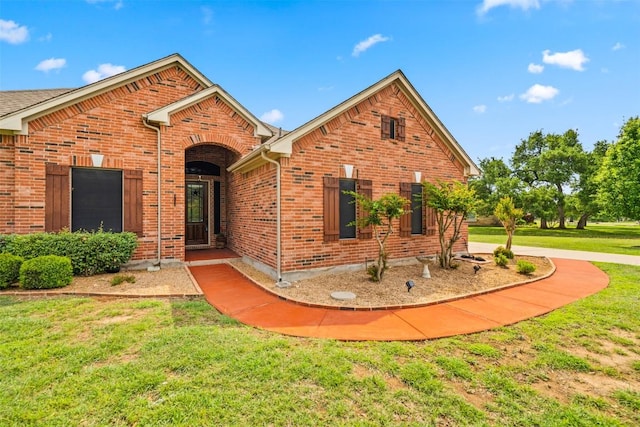 462 Shelf Rock, Driftwood, TX 78619 - view of front of property with a front yard and brick siding
