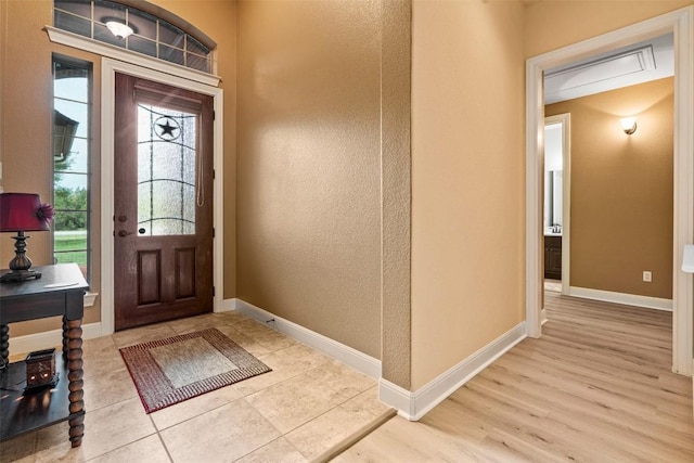 462 Shelf Rock, Driftwood, TX 78619 - entrance foyer featuring healthy amount of natural light, baseboards, a textured wall, and wood finished floors