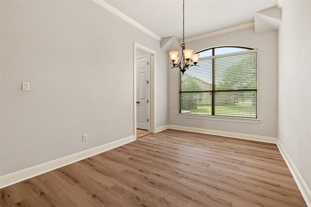 462 Shelf Rock, Driftwood, TX 78619 - unfurnished room with a chandelier, ornamental molding, wood finished floors, and baseboards