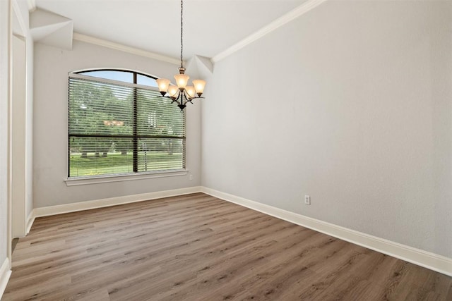 462 Shelf Rock, Driftwood, TX 78619 - spare room featuring a chandelier, baseboards, wood finished floors, and ornamental molding